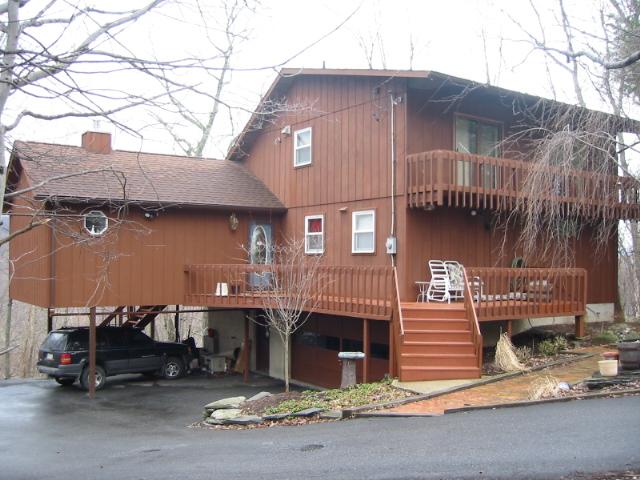 10 Cherry Ridge Road Layton, NJ 07851 - Photo 1 of 3 a front view of a house with a garage