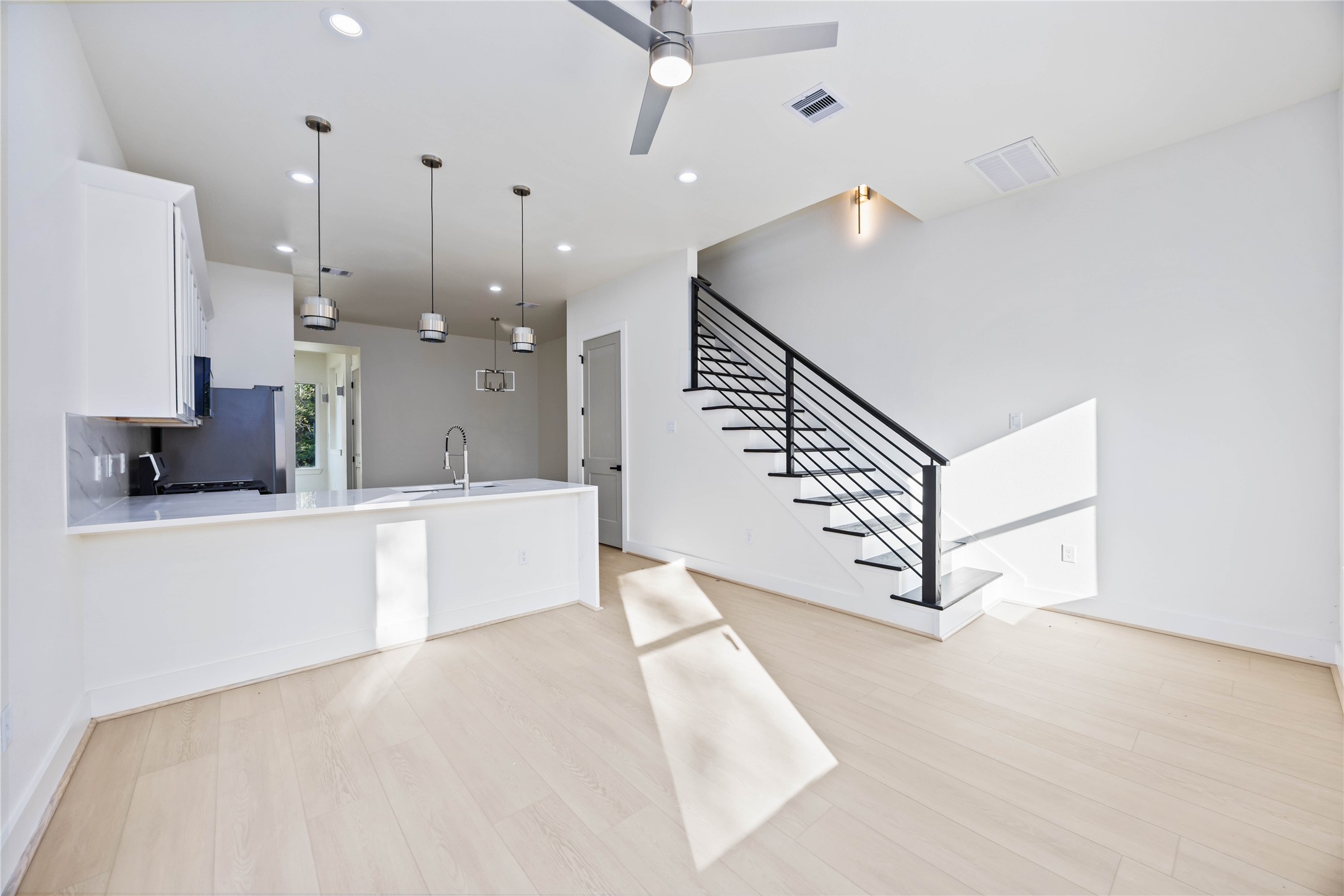 5222 Gold Street Houston, TX 77026 - Photo 13 of 28 a view of kitchen with furniture and a ceiling fan