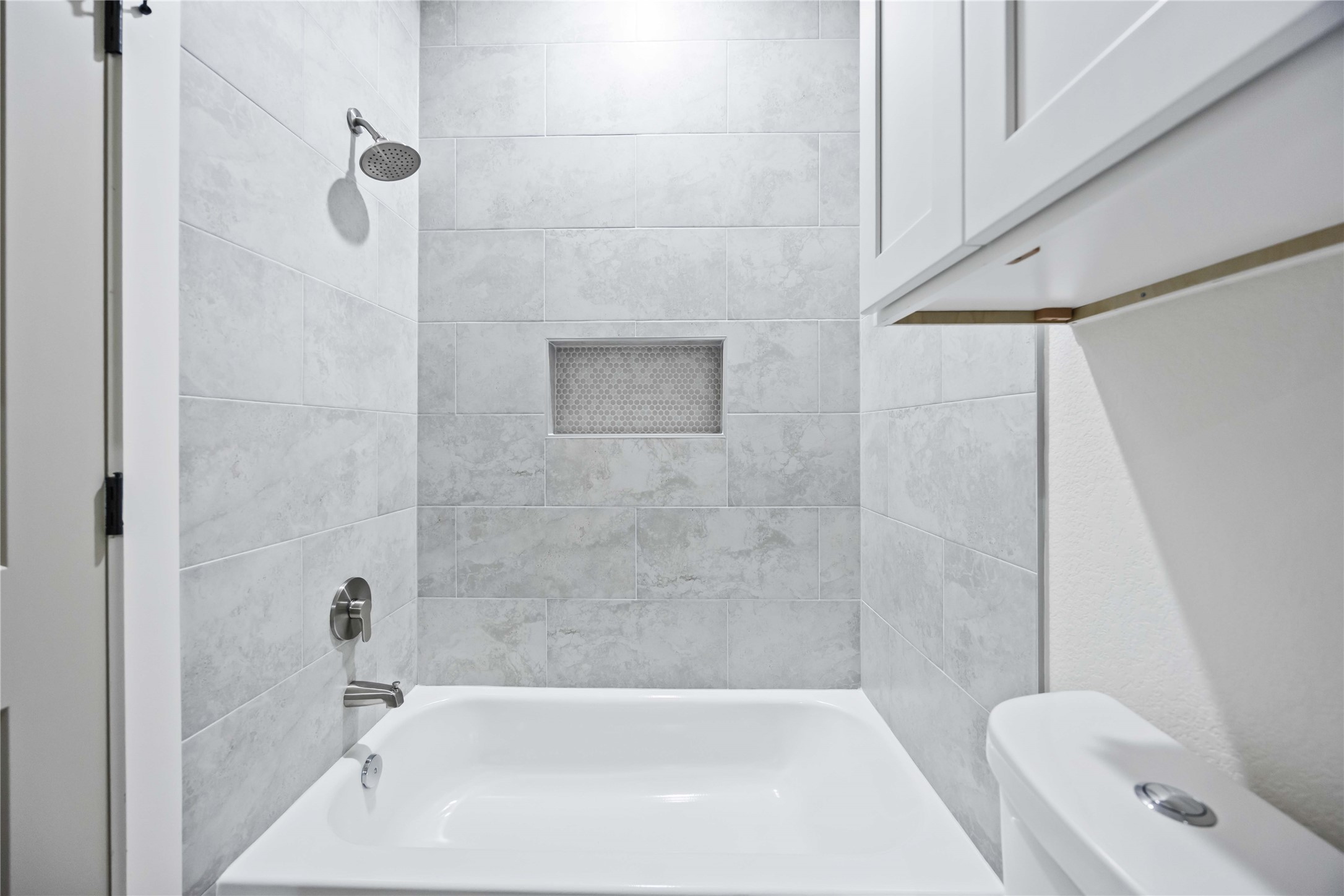 5222 Gold Street Houston, TX 77026 - Photo 17 of 28 a bathroom with a bathtub and a shower