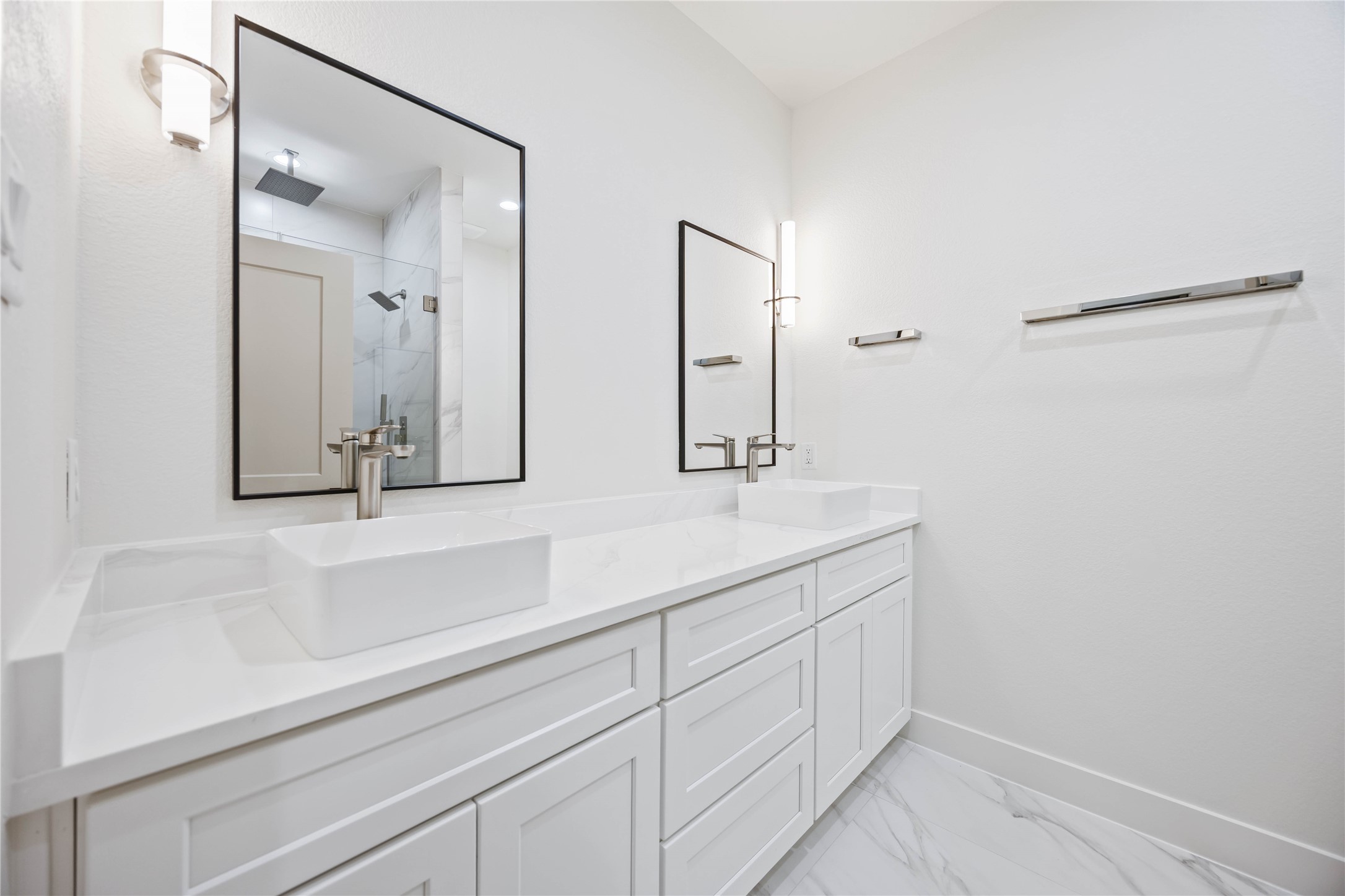 5222 Gold Street Houston, TX 77026 - Photo 18 of 28 a bathroom with a double vanity sink and mirror