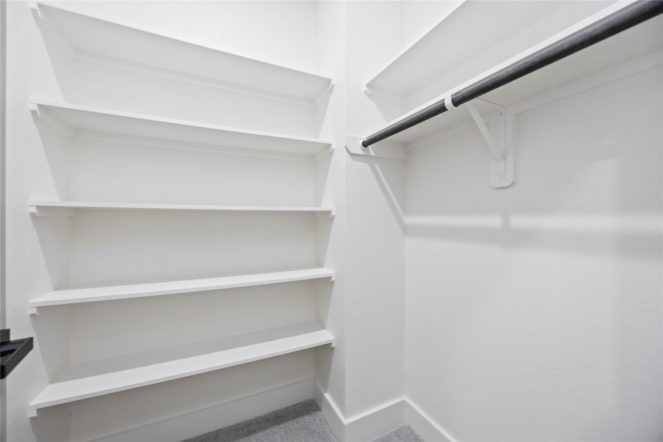 5222 Gold Street Houston, TX 77026 - Photo 20 of 28 a view of walk in closet with empty racks