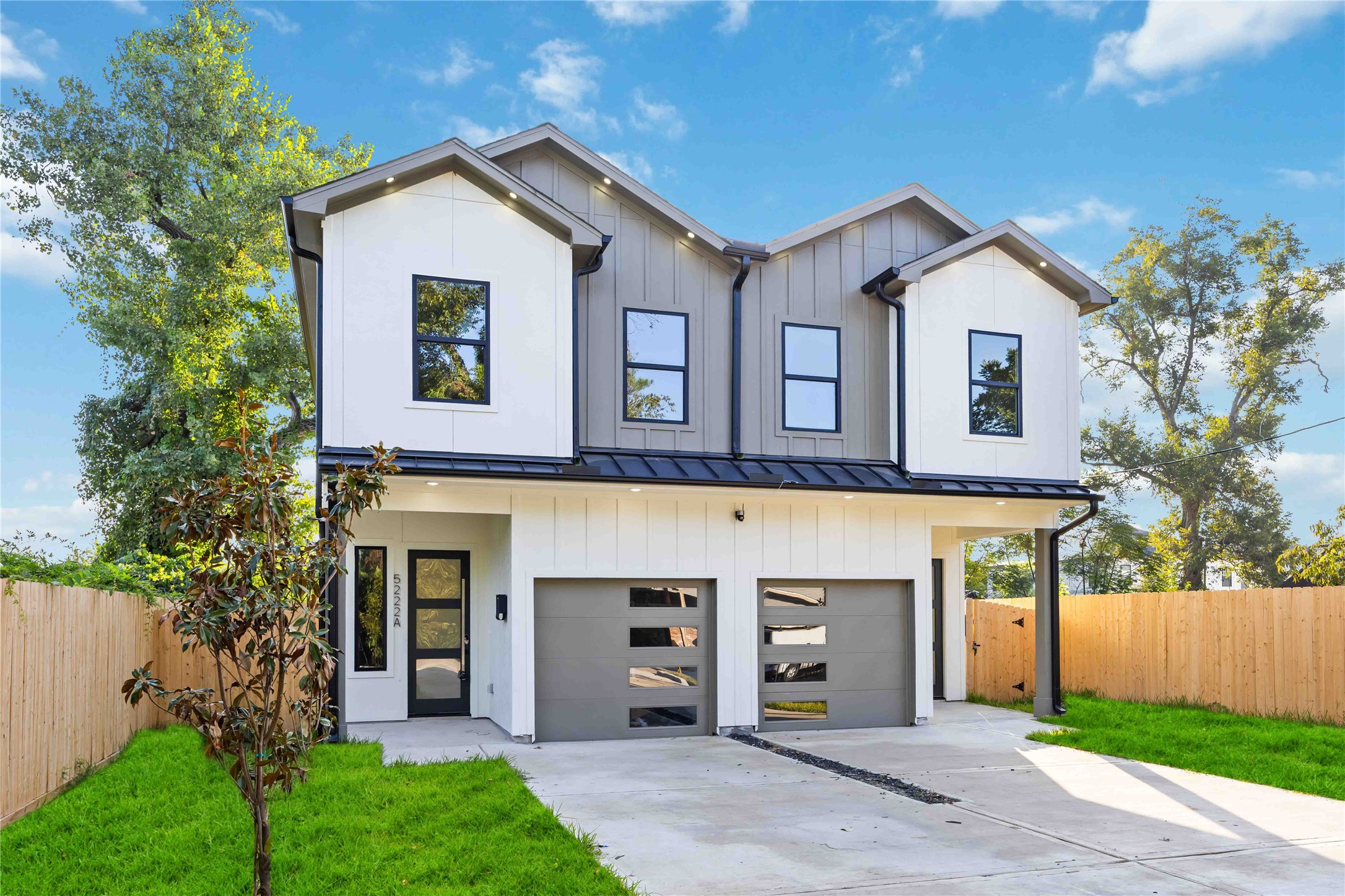 5222 Gold Street Houston, TX 77026 - Photo 2 of 28 a front view of a house with a garden and trees