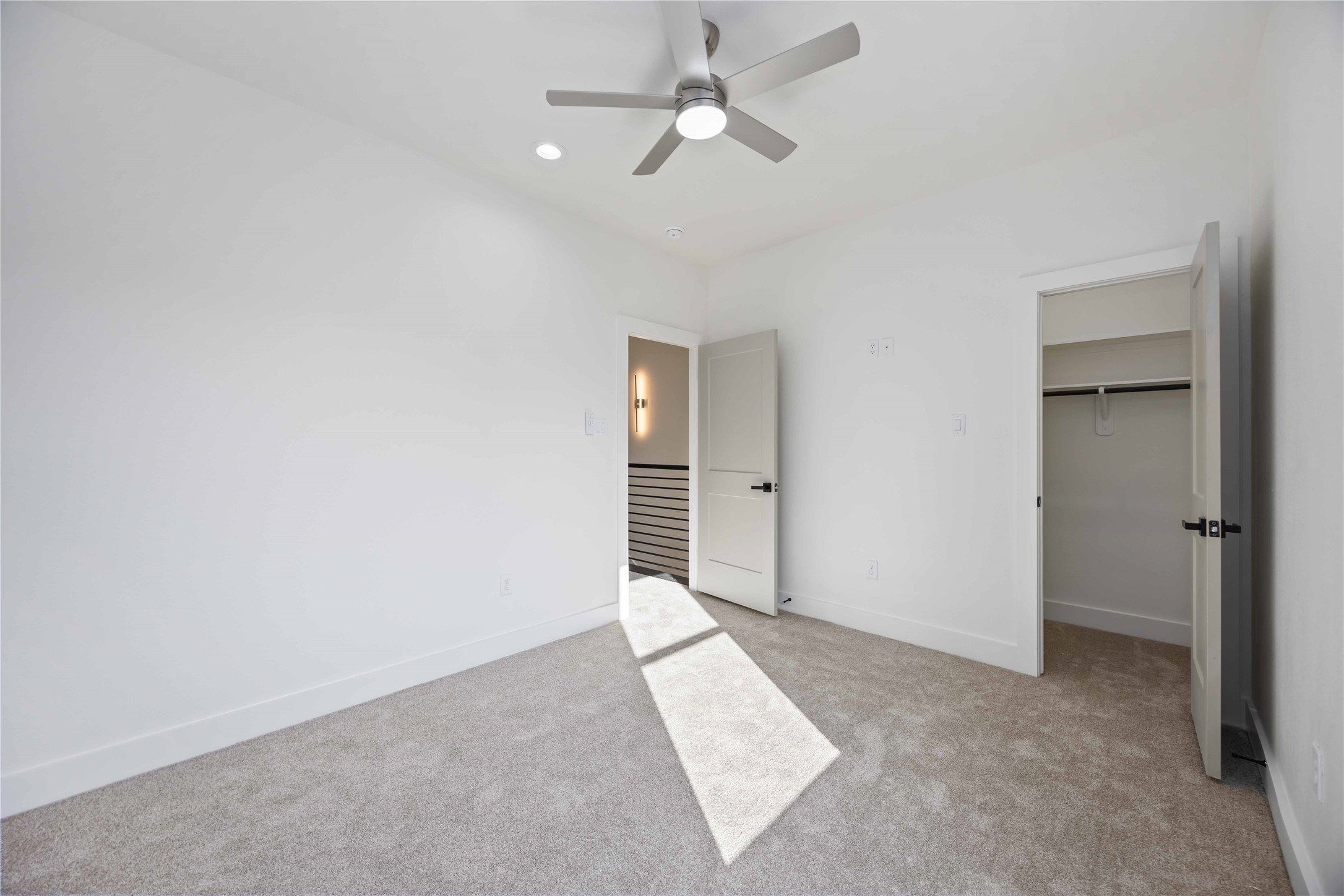 5222 Gold Street Houston, TX 77026 - Photo 26 of 28 a view of livingroom with an empty space and a ceiling fan
