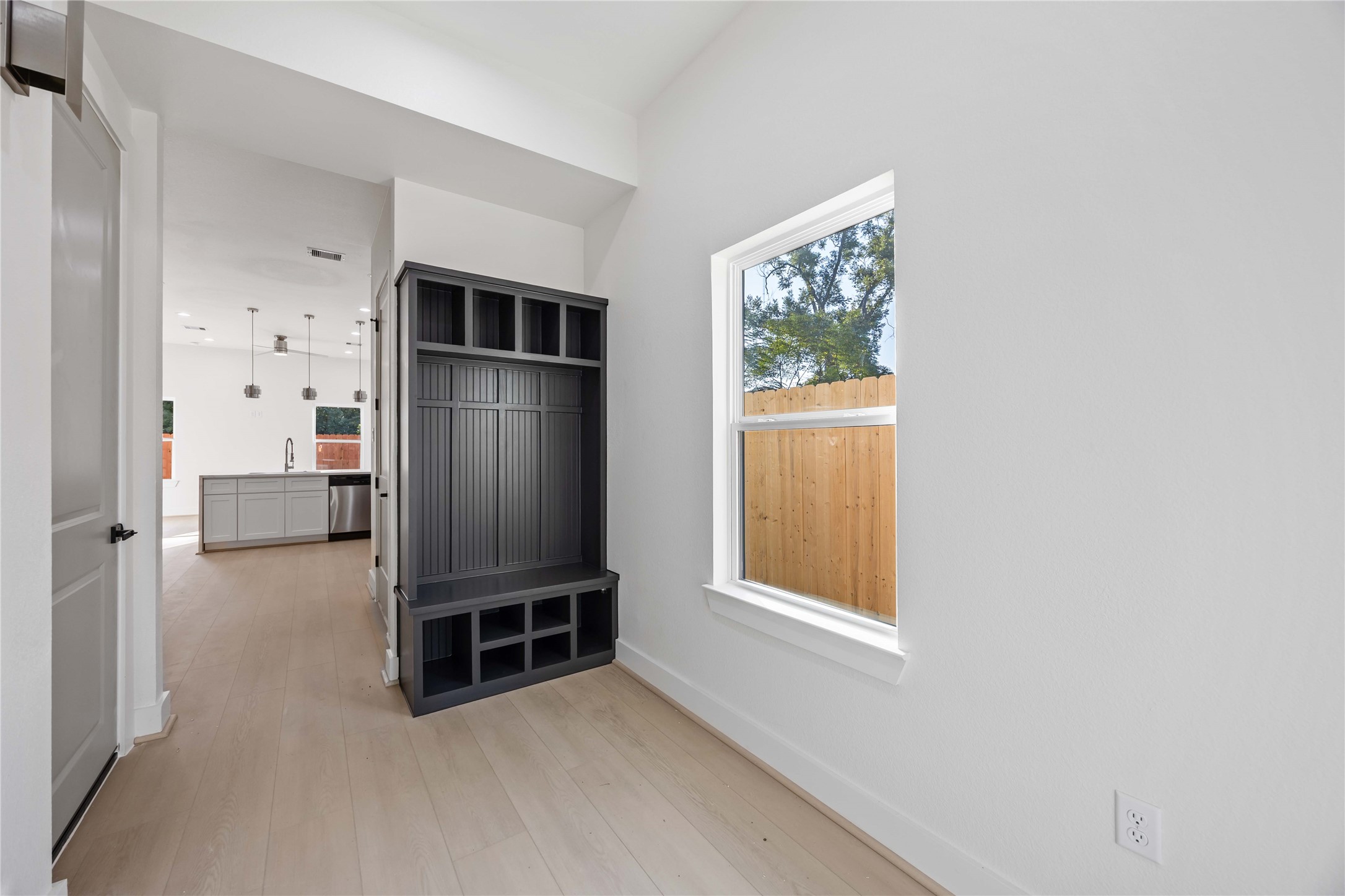 5222 Gold Street Houston, TX 77026 - Photo 5 of 28 an empty room with windows closet and cabinet