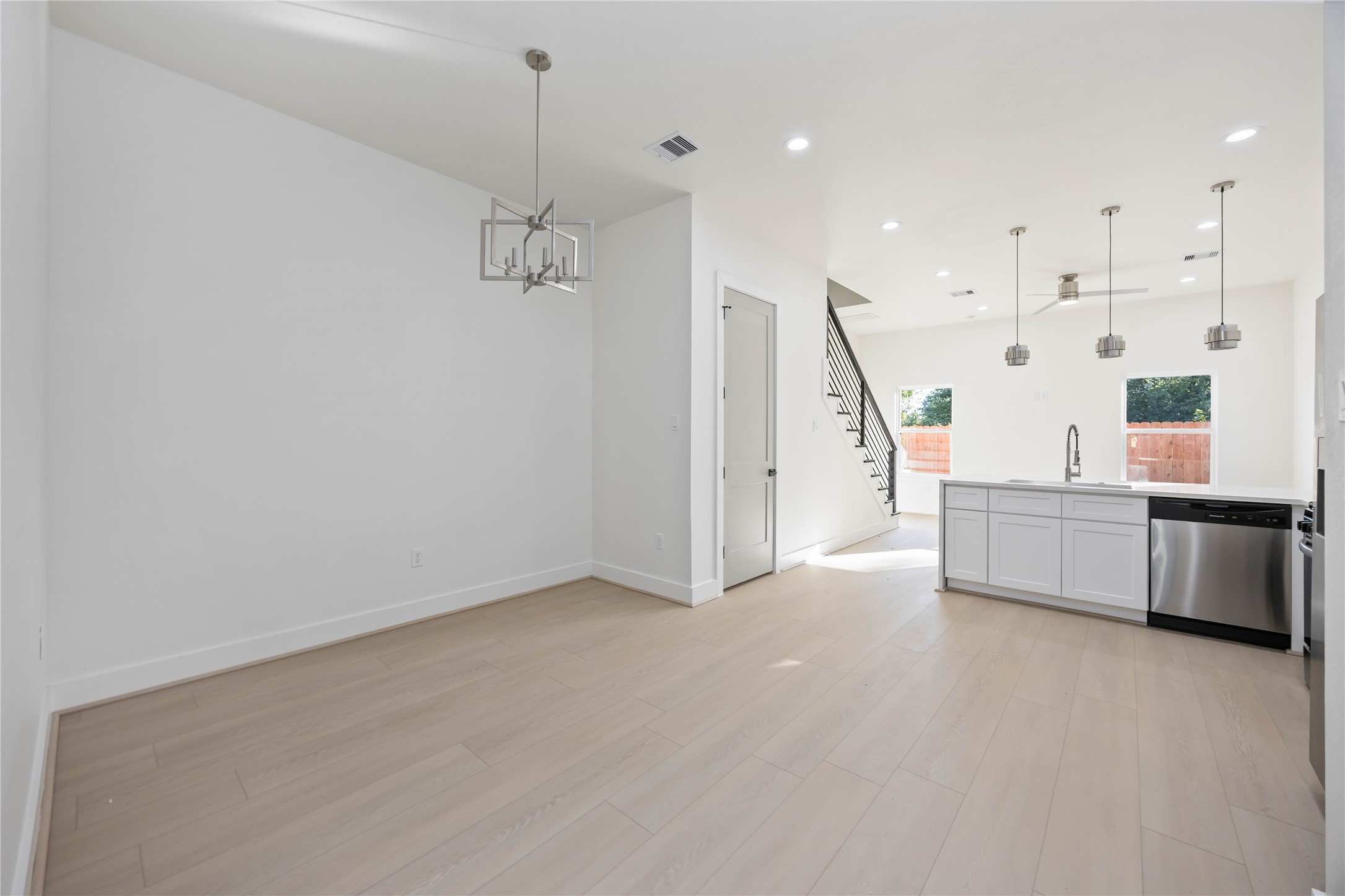 5222 Gold Street Houston, TX 77026 - Photo 6 of 28 a view of an empty room with kitchen and a window