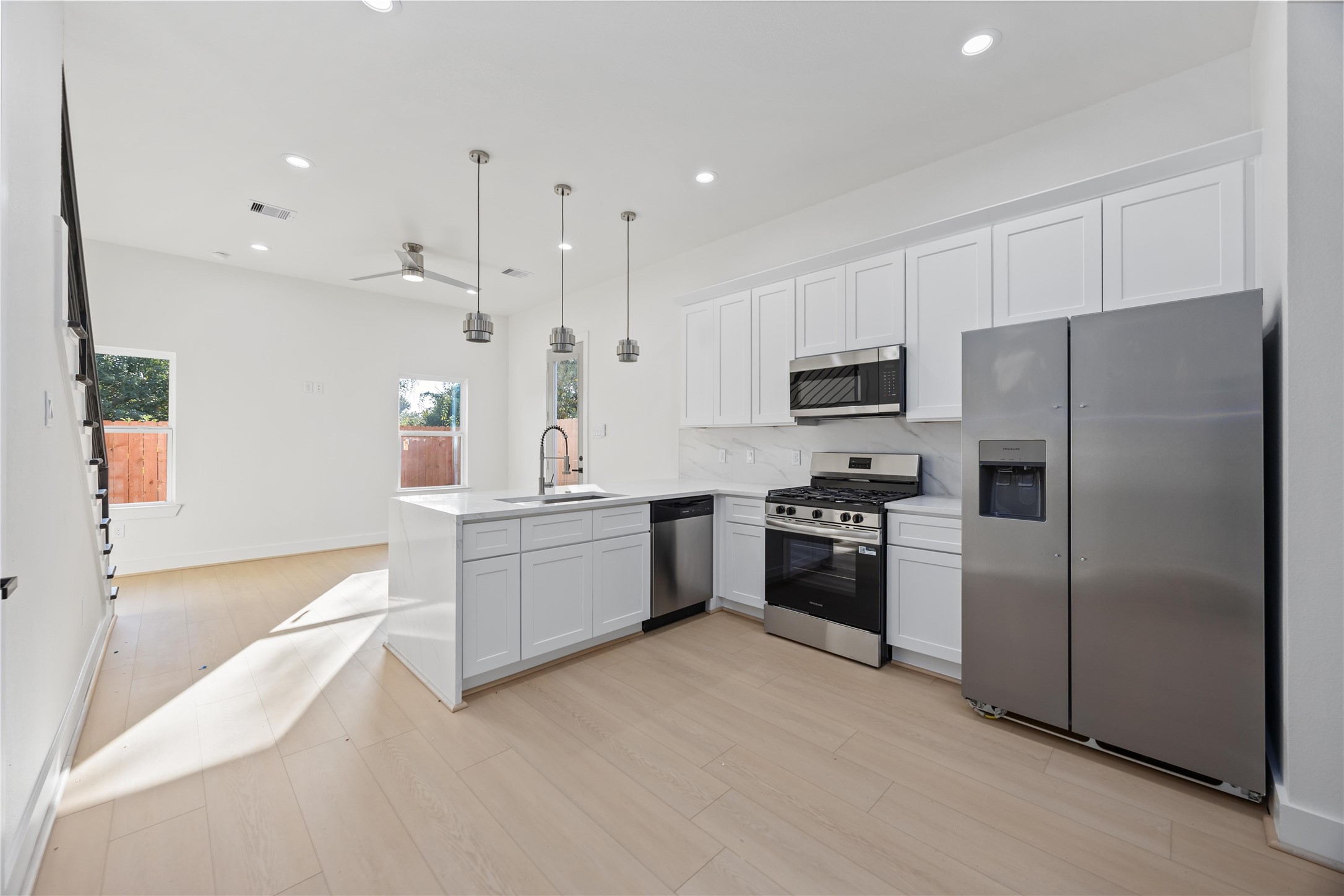 5222 Gold Street Houston, TX 77026 - Photo 8 of 28 a kitchen with a refrigerator stove and microwave