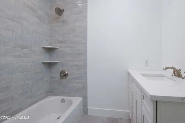 a bathroom with a sink and a bathtub