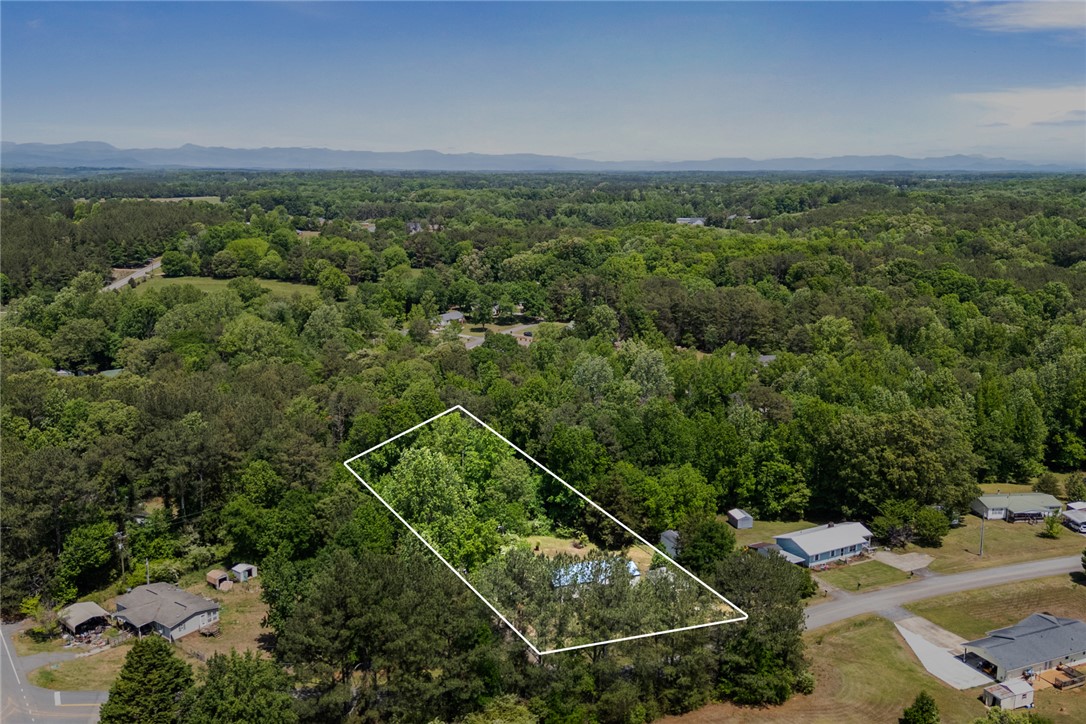 209 Short Cut Road Westminster, SC 29693 - Photo 18 of 27 This verdant expanse offers tranquil living with scenic distant mountains.