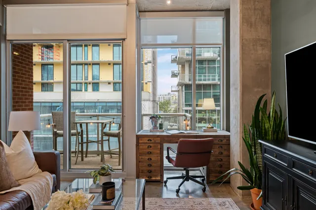 a living room with furniture and a flat screen tv