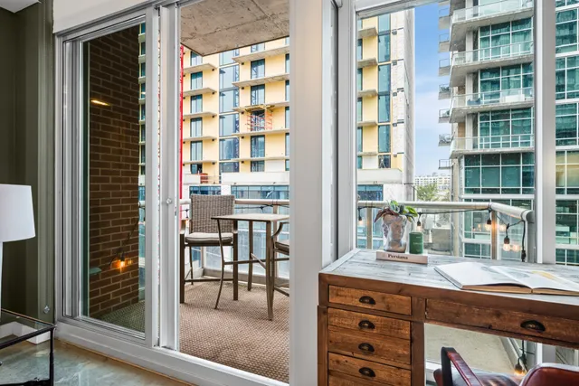 a kitchen view with table and chairs