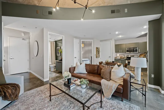 a living room with furniture or couch and a table