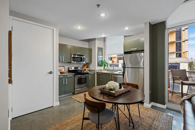 a kitchen with a table and chairs in it