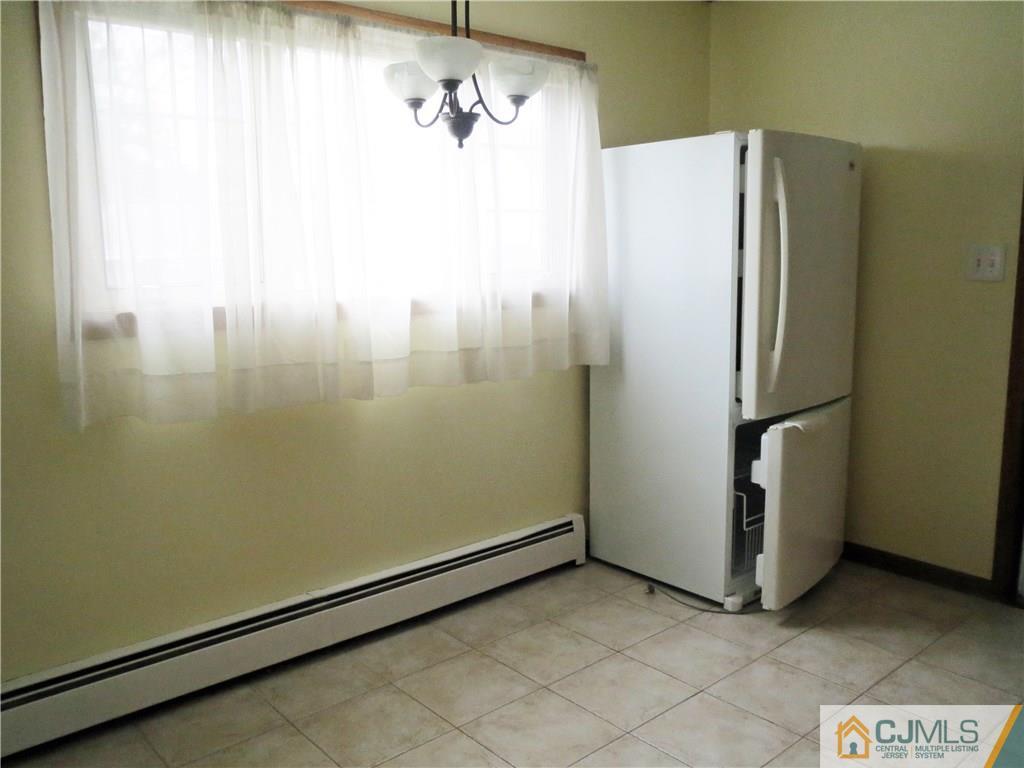 8 Sanders Road Edison, NJ 08817 - Photo 12 of 17 a view of a refrigerator in a kitchen