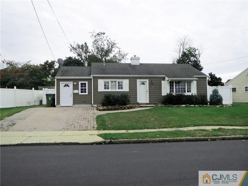 8 Sanders Road Edison, NJ 08817 - Photo 17 of 17 a front view of a house with a garden and yard