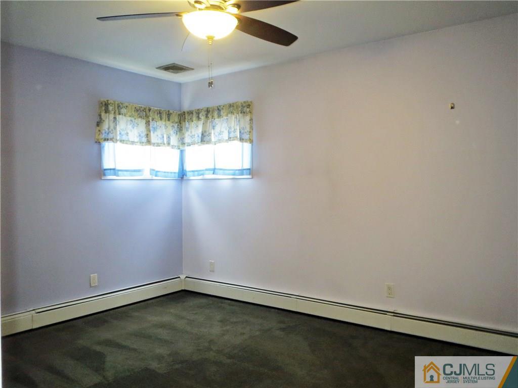 8 Sanders Road Edison, NJ 08817 - Photo 5 of 17 an empty room with a window