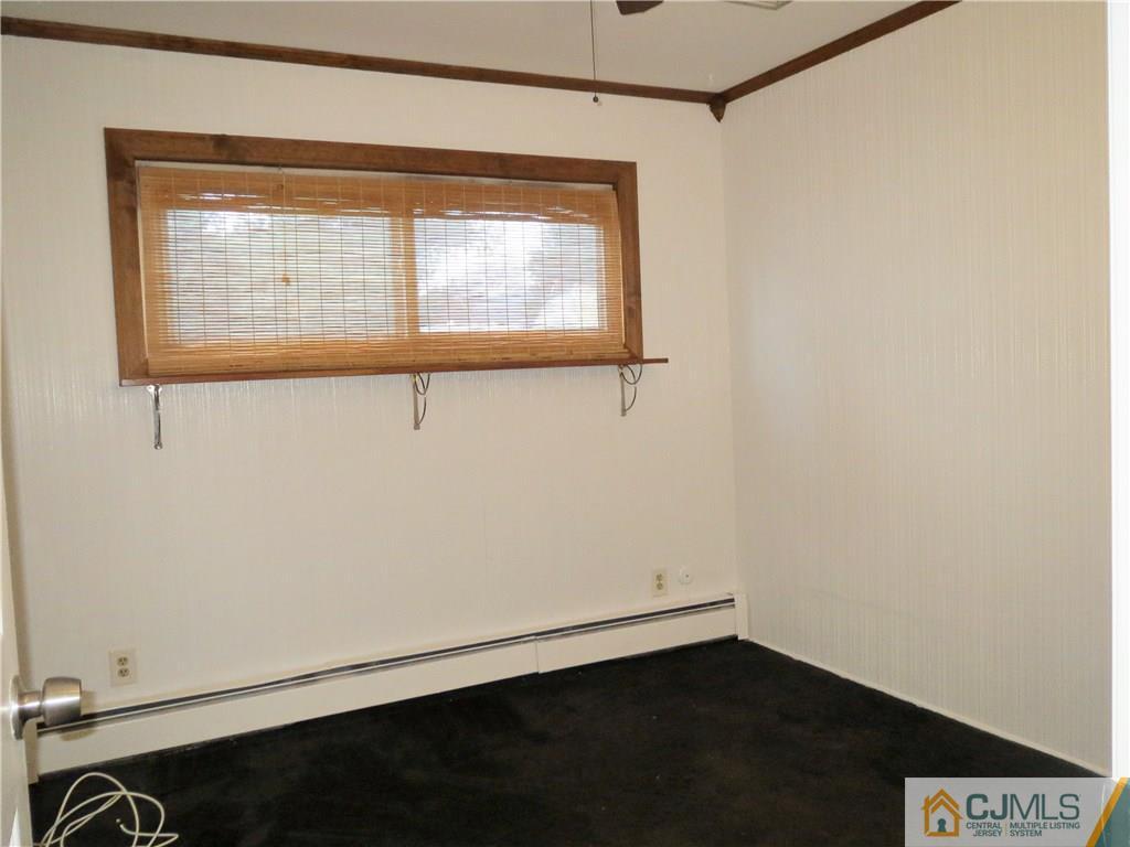 8 Sanders Road Edison, NJ 08817 - Photo 7 of 17 a view of an empty room with a window