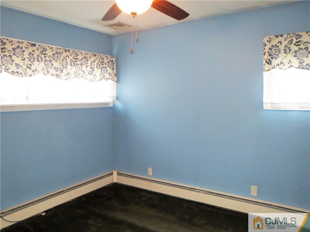 8 Sanders Road Edison, NJ 08817 - Photo 8 of 17 an empty room with a window