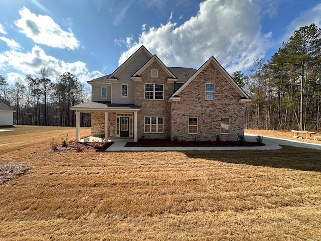 a front view of a house with a yard