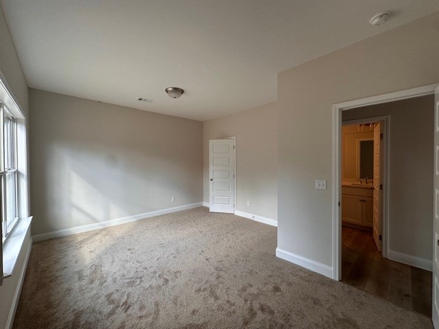8715 McKee Road Upatoi, GA 31829 - Photo 11 of 29 an empty room with windows and closet