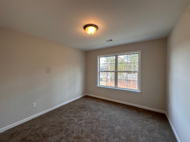 8715 McKee Road Upatoi, GA 31829 - Photo 14 of 29 an empty room with a window