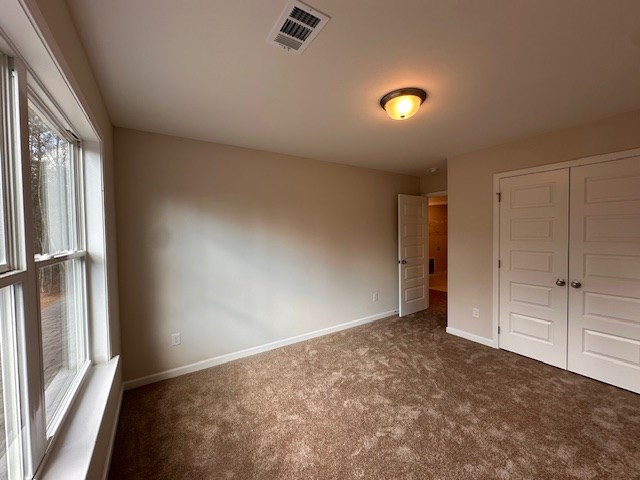 8715 McKee Road Upatoi, GA 31829 - Photo 15 of 29 an empty room with windows