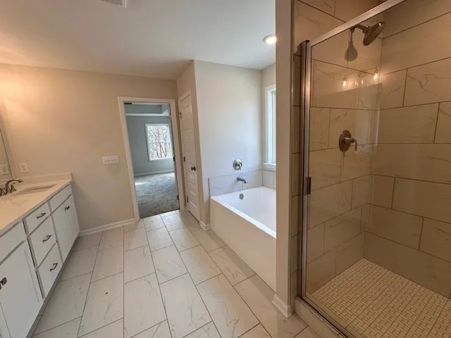 a bathroom with a bathtub and a sink