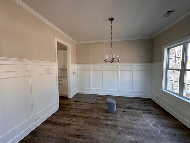 8715 McKee Road Upatoi, GA 31829 - Photo 3 of 29 an empty room with wooden floor and windows
