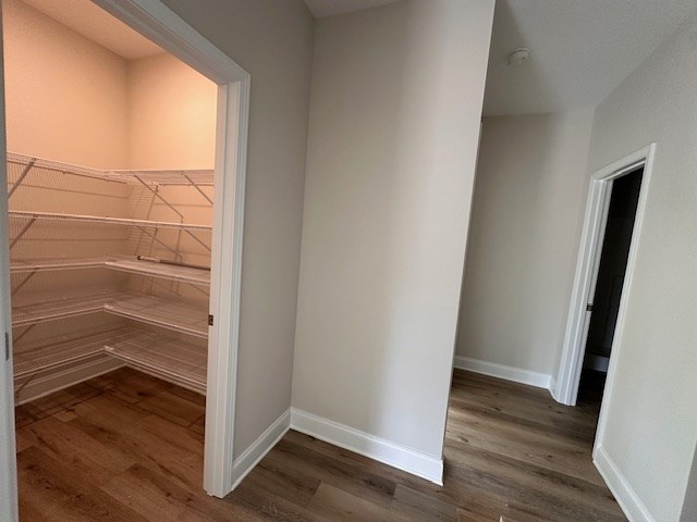 8715 McKee Road Upatoi, GA 31829 - Photo 8 of 29 an empty room with wooden floor and entrance