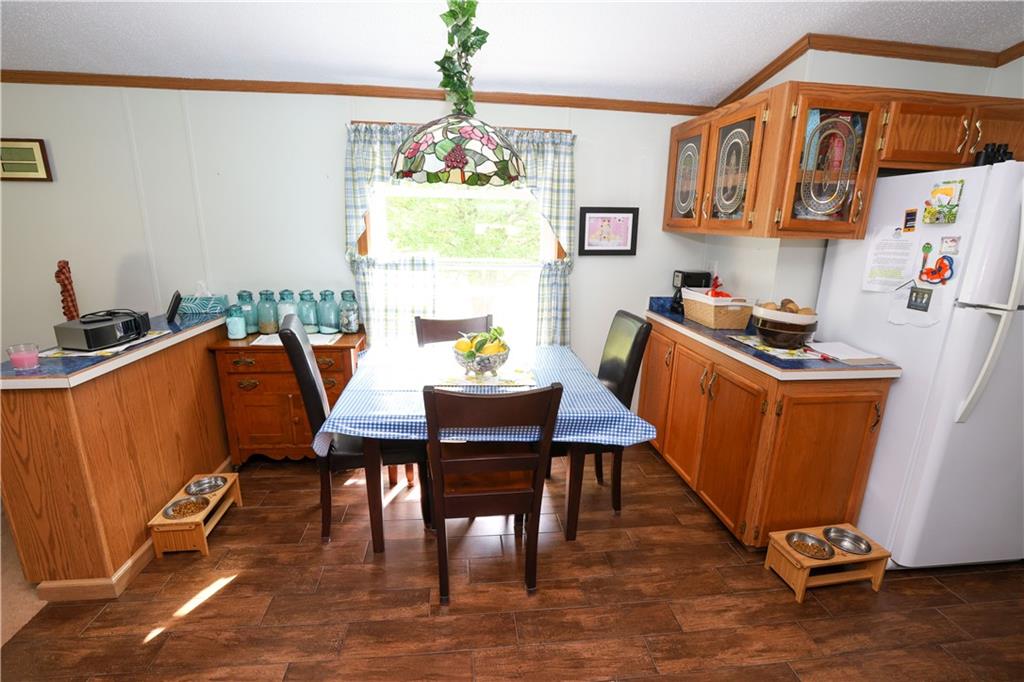 471 Braddock Road Markleysburg, PA 15459 - Photo 8 of 44 a view of a dining room with furniture and chandelier