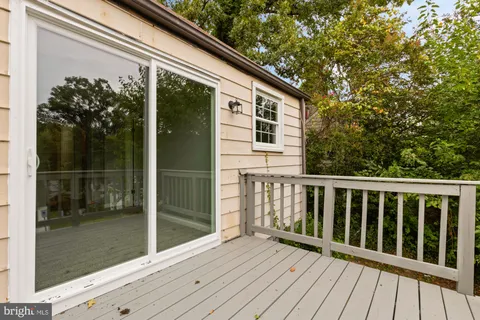 a view of yard with swimming pool and green space