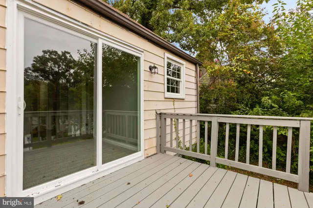 a view of yard with swimming pool and green space