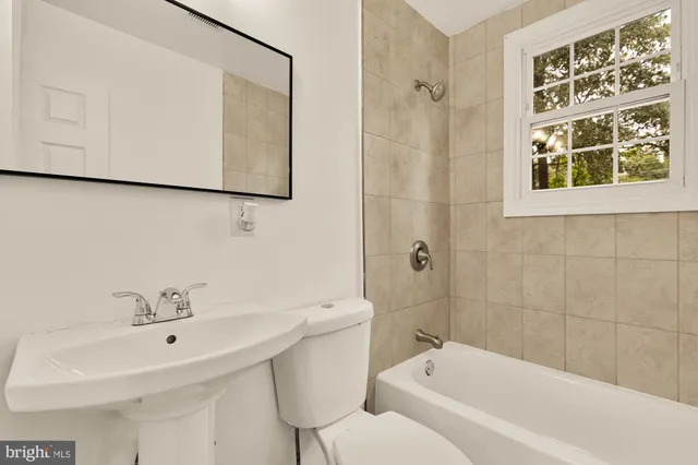 a bathroom with a sink and a bathtub