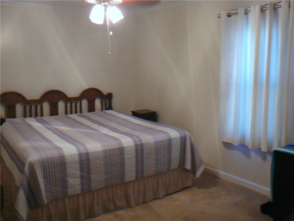 37 Camelia Circle Williamston, SC 29697 - Photo 14 of 25 This cozy bedroom features warm lighting and ample space for relaxation.