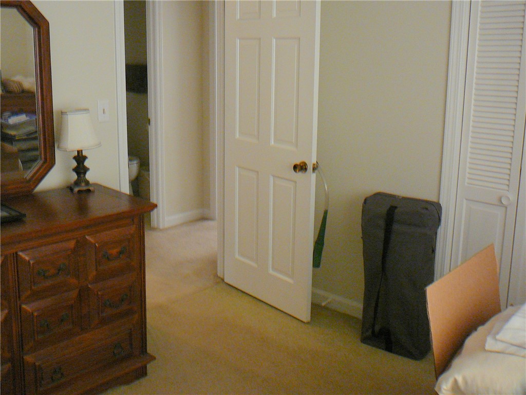 37 Camelia Circle Williamston, SC 29697 - Photo 16 of 25 This cozy bedroom features carpeted flooring and easy access to an adjoining bathroom.