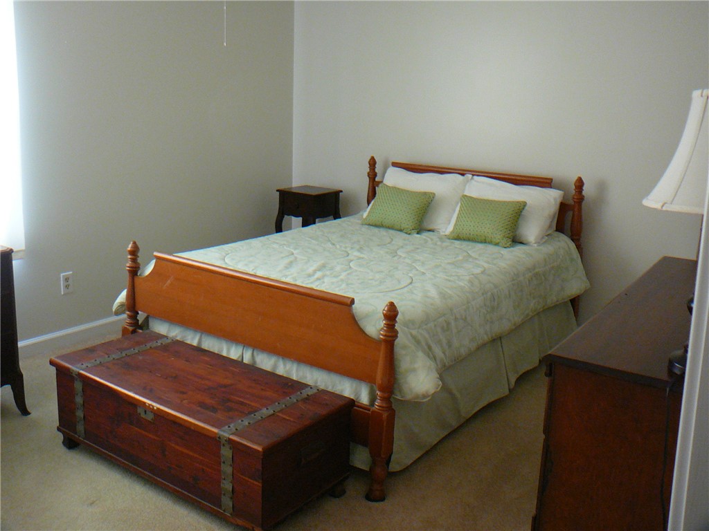 37 Camelia Circle Williamston, SC 29697 - Photo 17 of 25 This cozy bedroom features a warm wooden bed frame and soft neutral tones.
