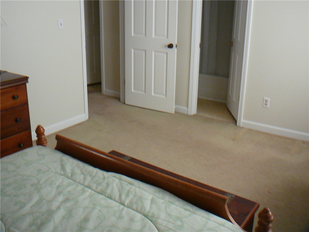 37 Camelia Circle Williamston, SC 29697 - Photo 18 of 25 This spacious bedroom offers comfortable carpeting and convenient access to an adjoining bathroom.