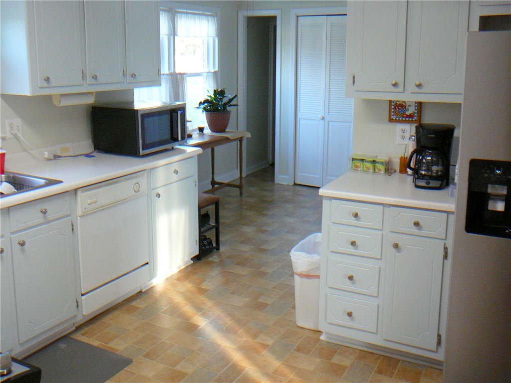 37 Camelia Circle Williamston, SC 29697 - Photo 7 of 25 This cozy kitchen features a practical layout, bright cabinetry, and a clean aesthetic.