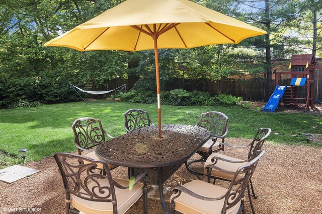 a view of an outdoor sitting area with furniture and backyard