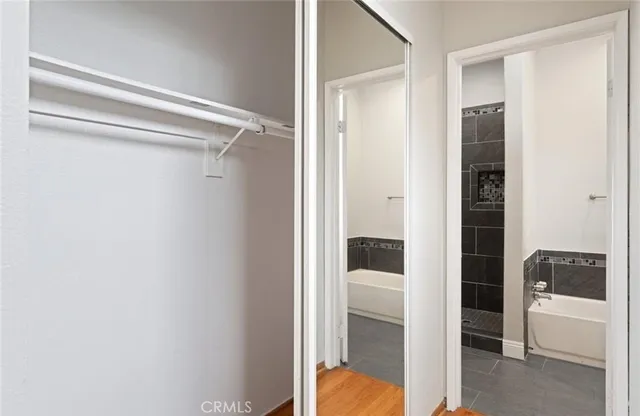 a bathroom with a tub and shower