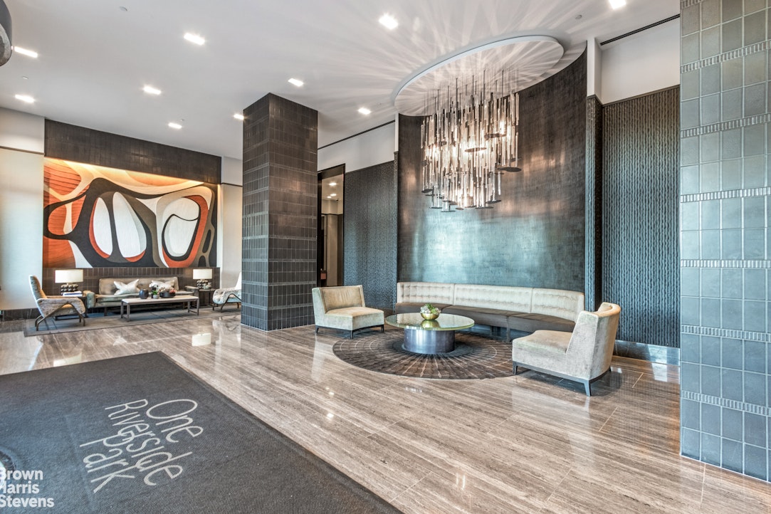 50 Riverside Boulevard, Unit 3H Manhattan, NY 10069 - Photo 12 of 21 a lobby with furniture and floor to ceiling window