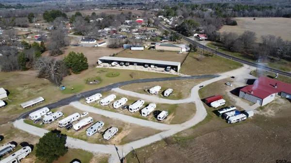 an aerial view of a swimming pool patio yard and outdoor seating