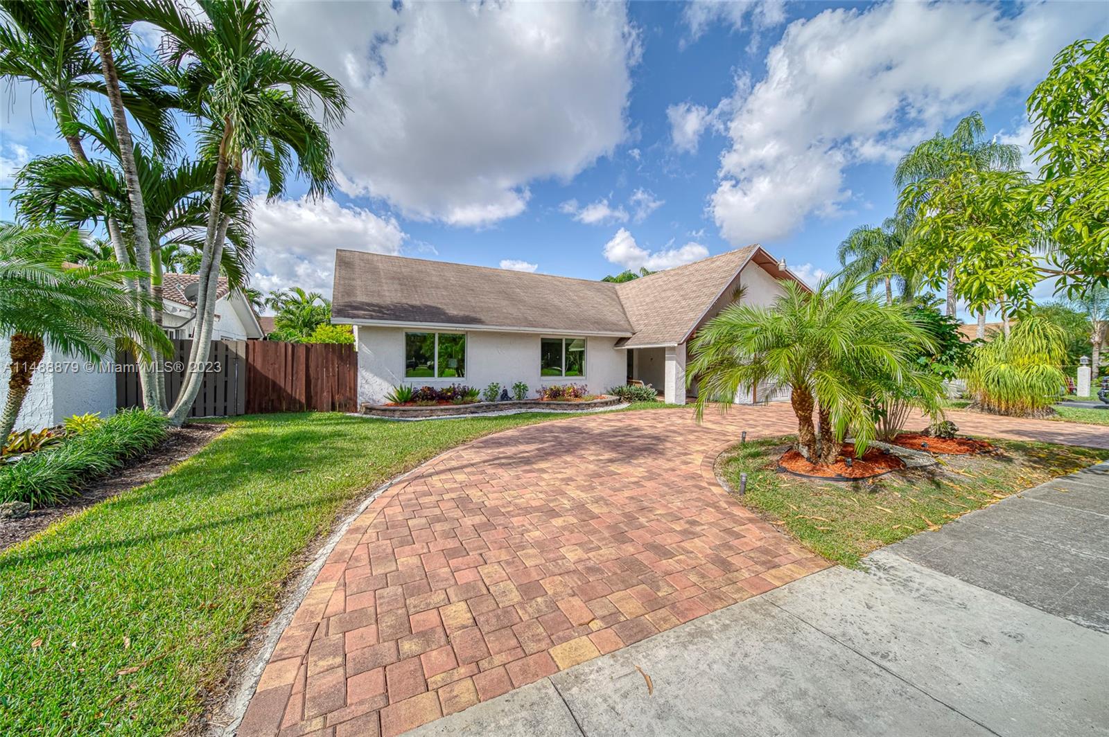 9904 Southwest 133rd Court Miami, FL 33186 - Photo 1 of 43 a front view of a house with garden
