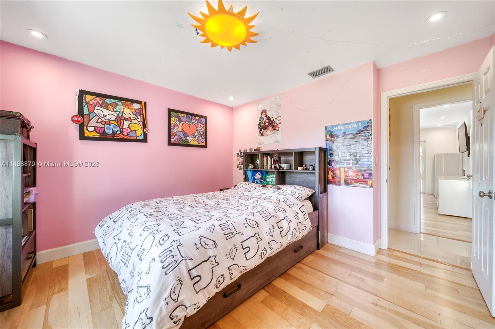 9904 Southwest 133rd Court Miami, FL 33186 - Photo 17 of 43 a bedroom with a bed and a chandelier