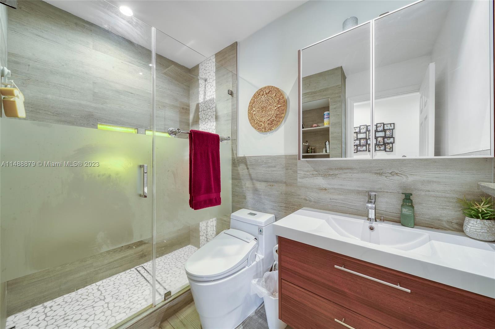 9904 Southwest 133rd Court Miami, FL 33186 - Photo 19 of 43 a bathroom with a toilet sink and mirror
