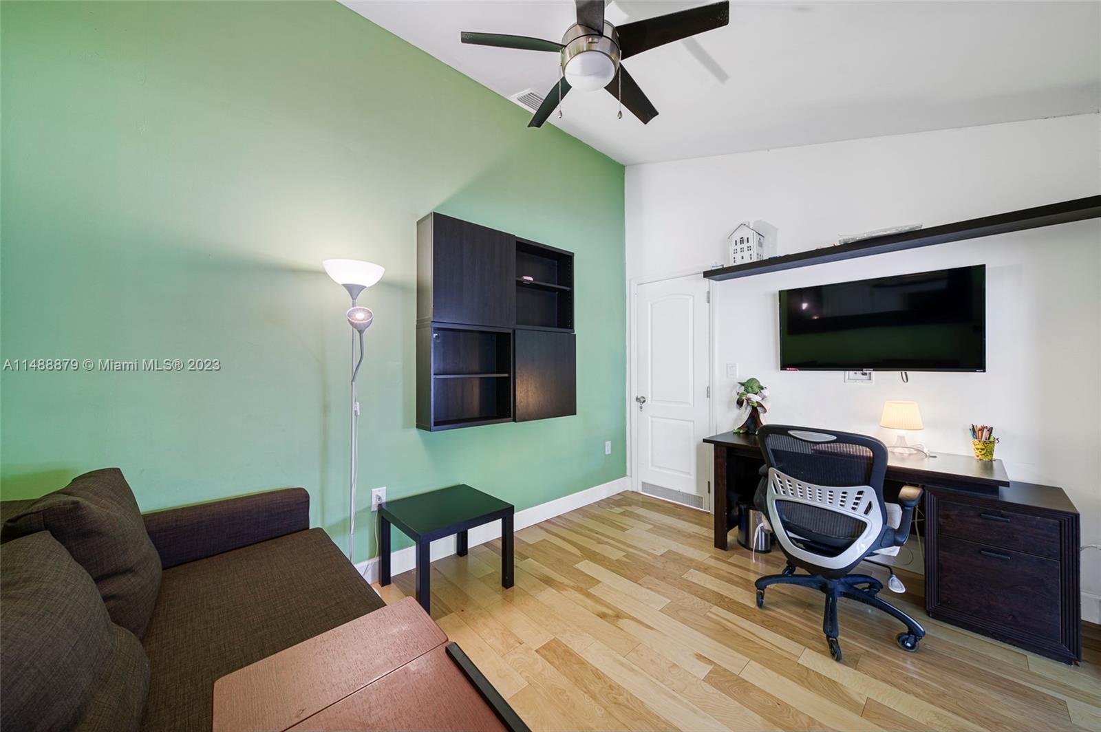 9904 Southwest 133rd Court Miami, FL 33186 - Photo 23 of 43 a living room with furniture and a flat screen tv