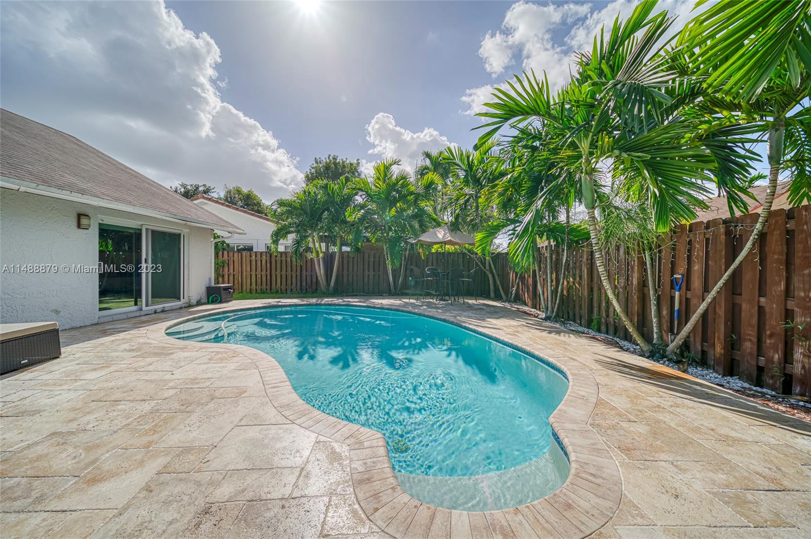 9904 Southwest 133rd Court Miami, FL 33186 - Photo 28 of 43 a view of a backyard with plants and tree