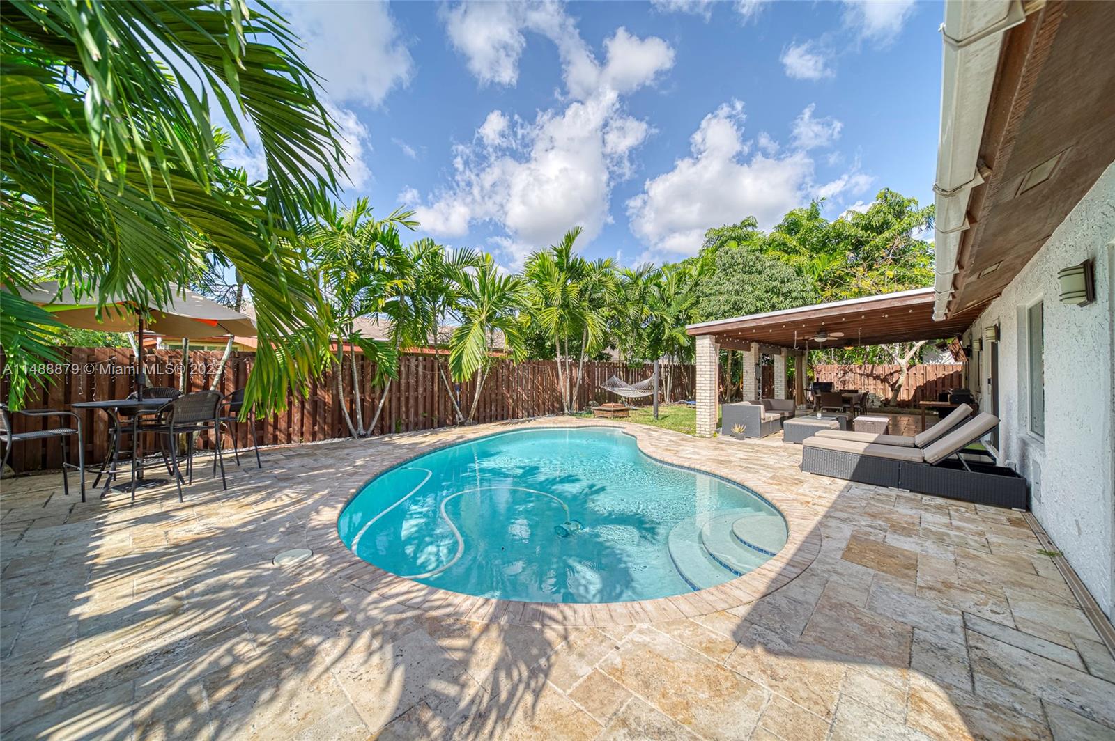 9904 Southwest 133rd Court Miami, FL 33186 - Photo 29 of 43 a view of a house with backyard porch and sitting area