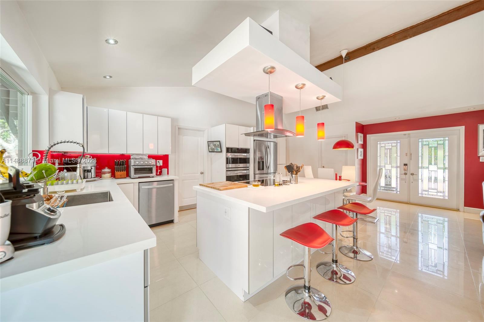 9904 Southwest 133rd Court Miami, FL 33186 - Photo 3 of 43 a kitchen that has a lot of white cabinets and appliances