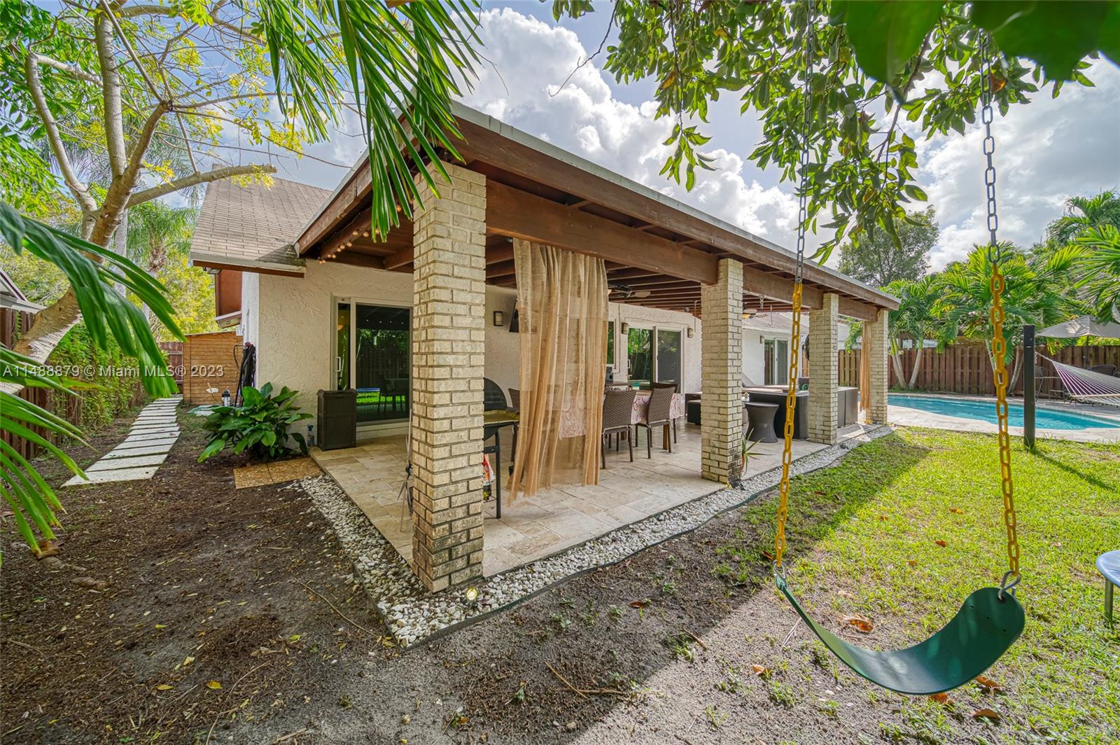 9904 Southwest 133rd Court Miami, FL 33186 - Photo 34 of 43 a view of a house with backyard and sitting area