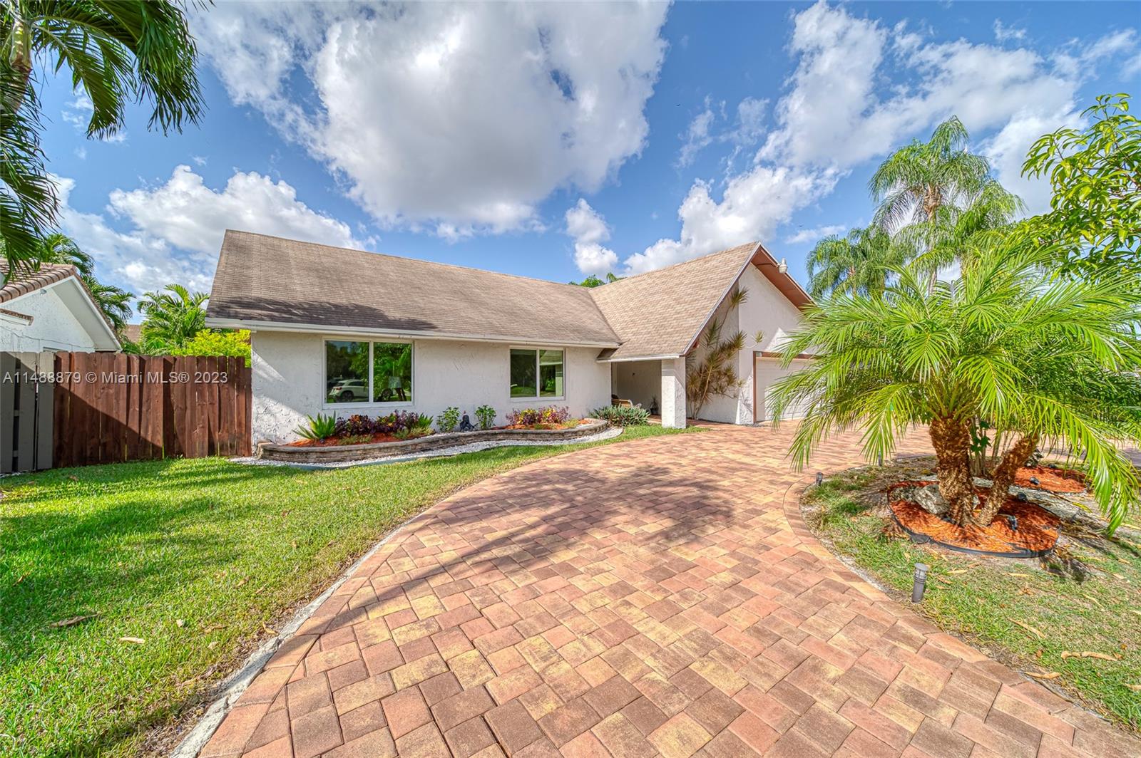 9904 Southwest 133rd Court Miami, FL 33186 - Photo 36 of 43 a front view of house with yard and green space